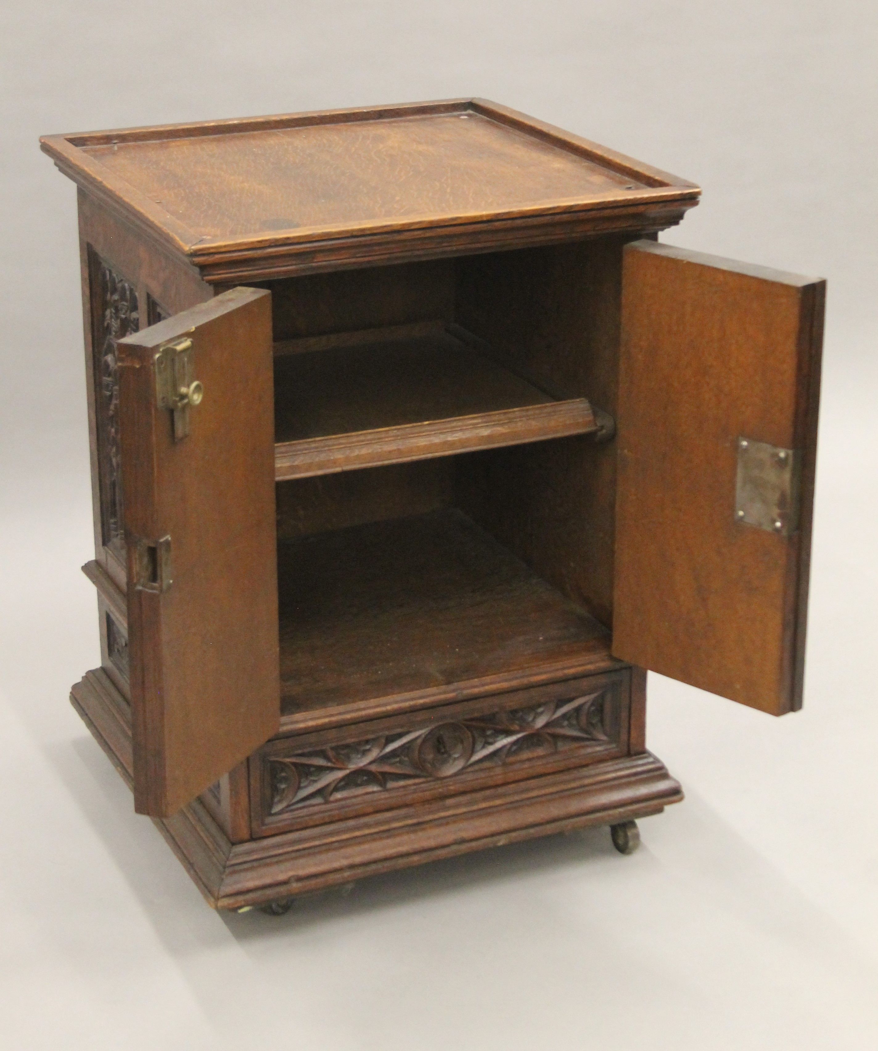 A small Victorian carved oak Gothic Revival cabinet with base drawer. 51.5 cm square. - Image 2 of 7