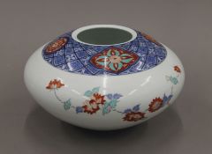 A Japanese porcelain vase of ovoid form. 17 cm high.