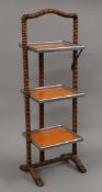 A mid-20th century Art Deco three-tier folding cake stand. 86 cm high.