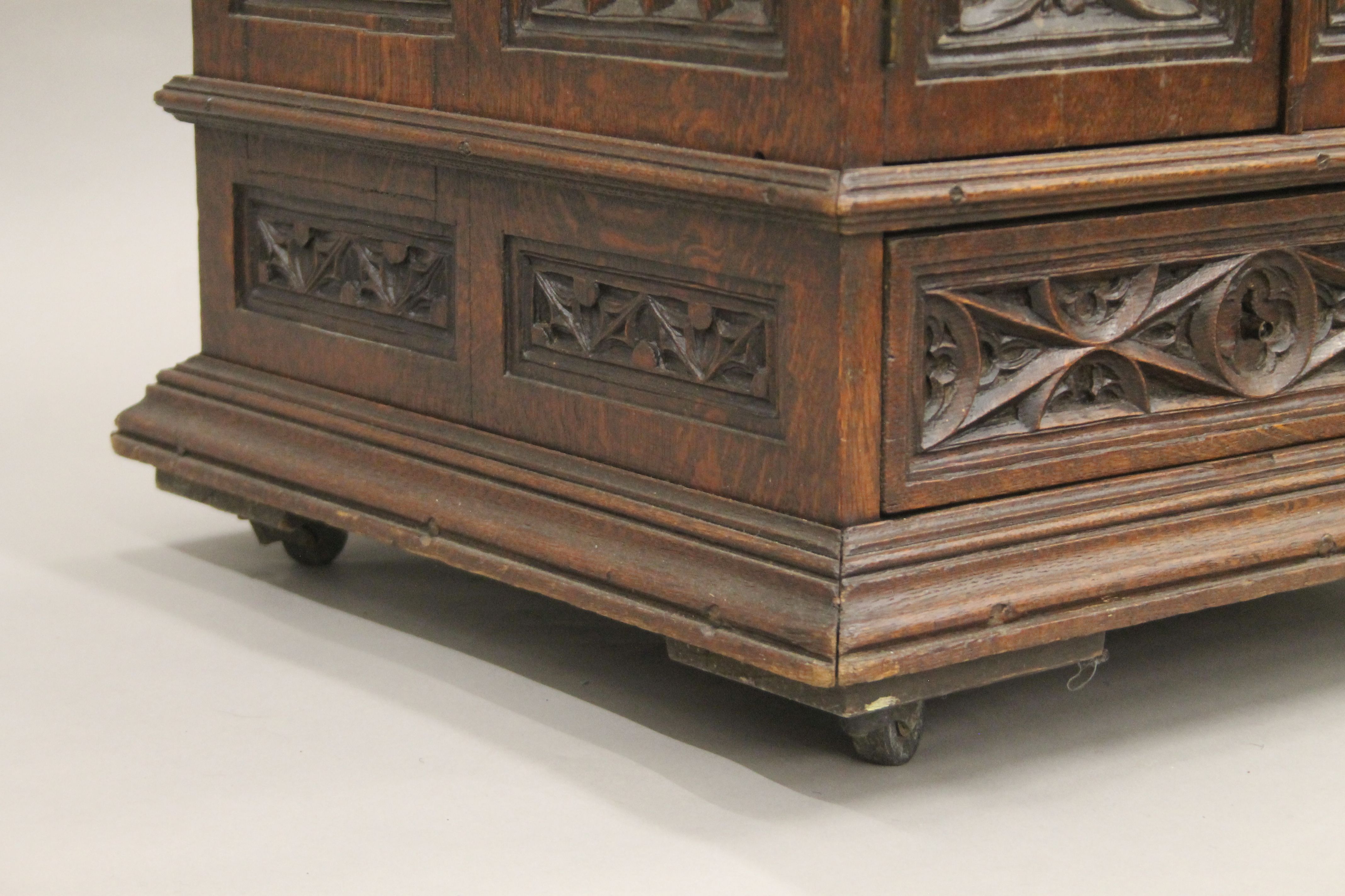 A small Victorian carved oak Gothic Revival cabinet with base drawer. 51.5 cm square. - Image 5 of 7