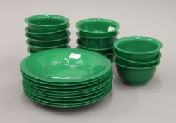 A quantity of Chinese Peking green glass bowls and plates. The plates 19.