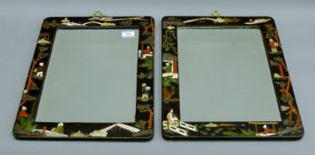 A pair of late 19th century Oriental lacquered hardstone bone and mother-of-pearl inlaid mirrors.