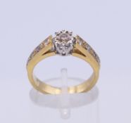 An unmarked 18 ct gold diamond ring. Ring size L/M. 5 grammes total weight.