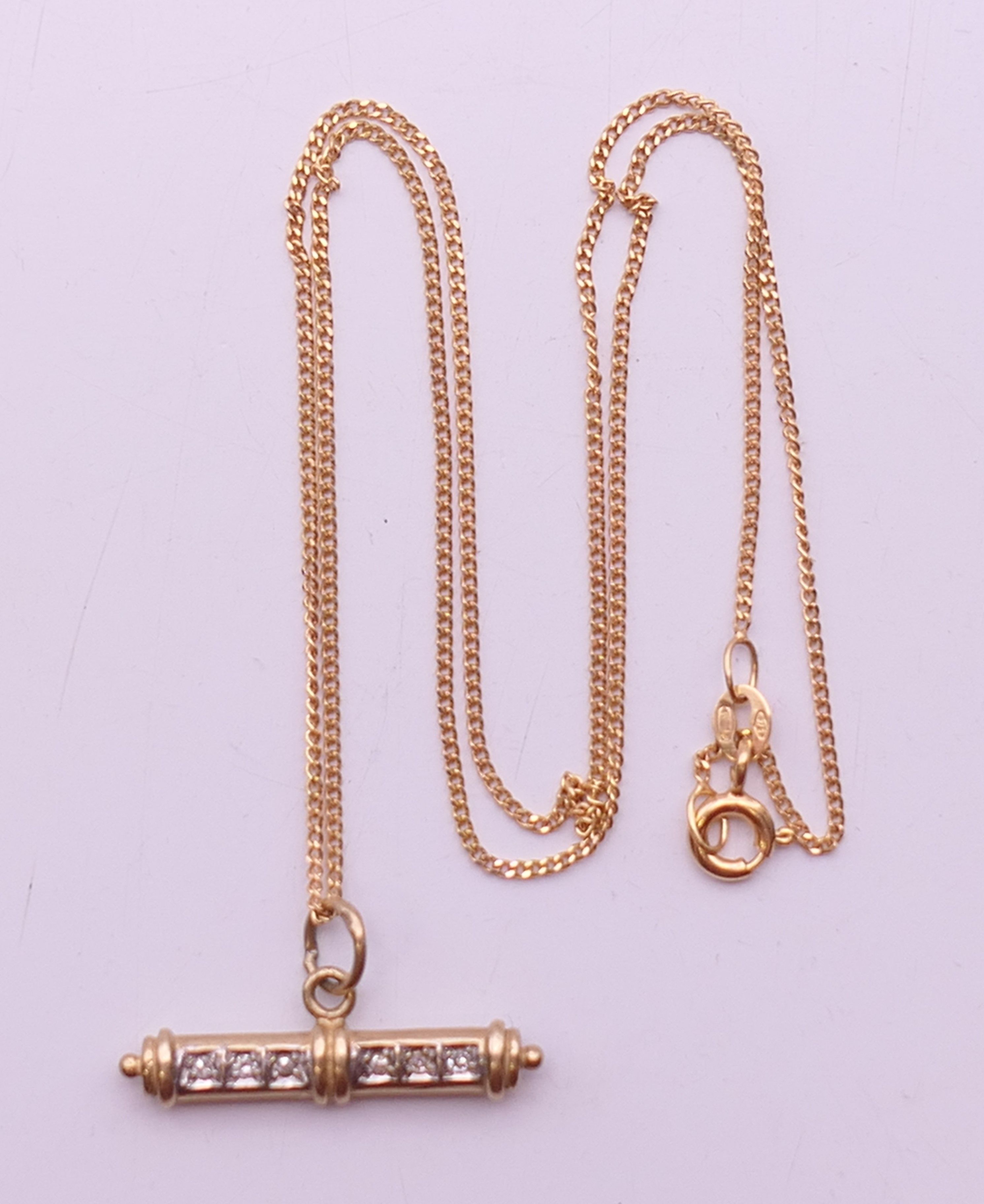 A 9 ct gold diamond set T-bar on a 9 ct gold chain. Bar 2.5 cm long, chain 41 cm long. 3. - Image 6 of 6