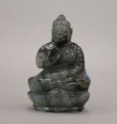 An opalescent stone model of Buddha. 9.5 cm high.
