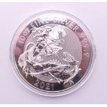 A 2021 10oz fine silver 10 pound coin.