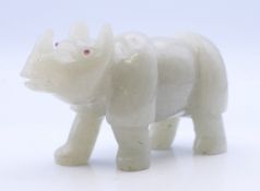 A jade model of a rhino. 9.5 cm long.