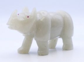 A jade model of a rhino. 9.5 cm long.