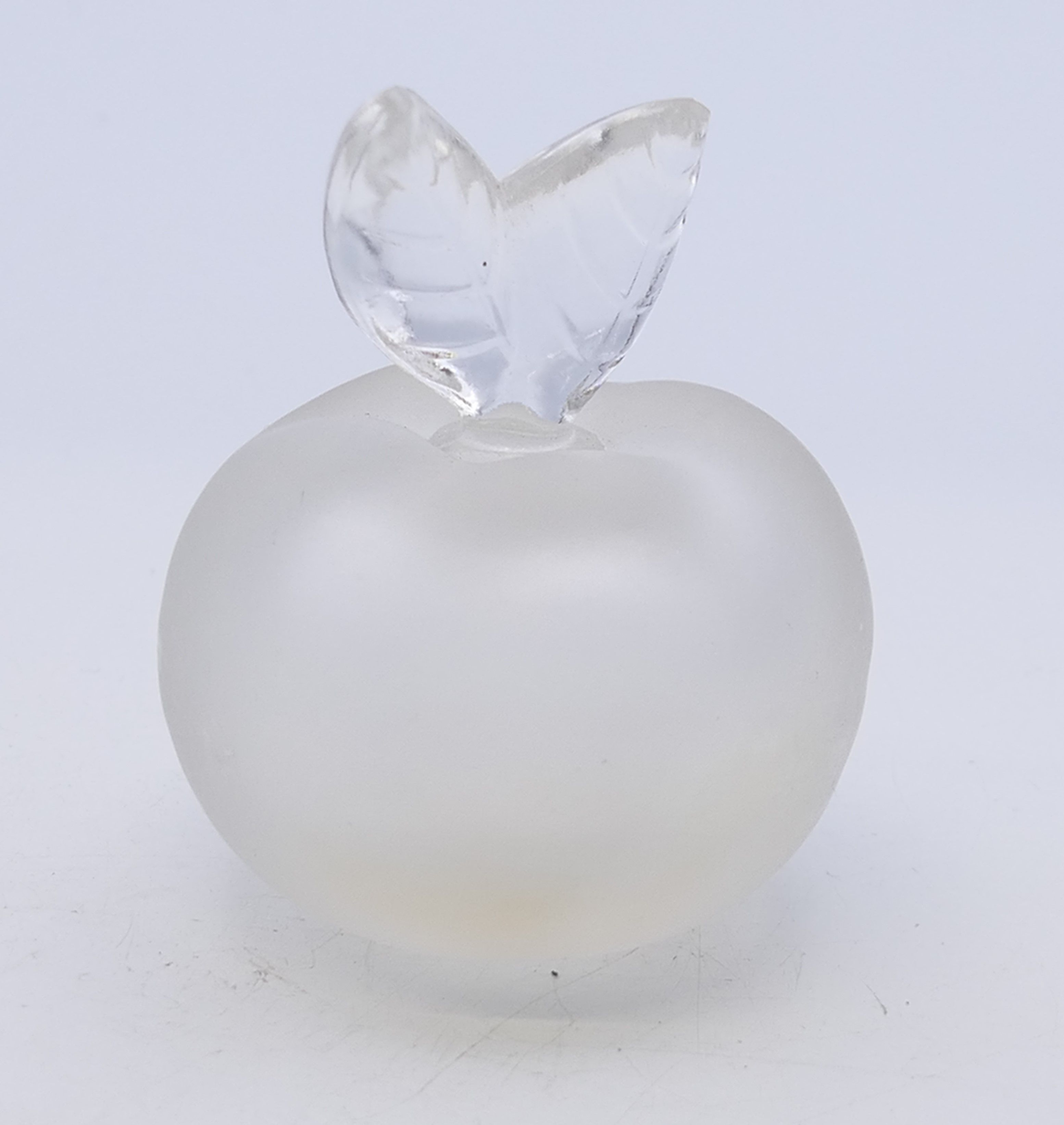 A Lalique Nina Ricci scent bottle. 6 cm high.