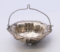 A sterling silver tea strainer. 7 cm diameter. 18 grammes.