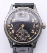A vintage gentleman's Minerva military wristwatch. 3.5 cm wide.