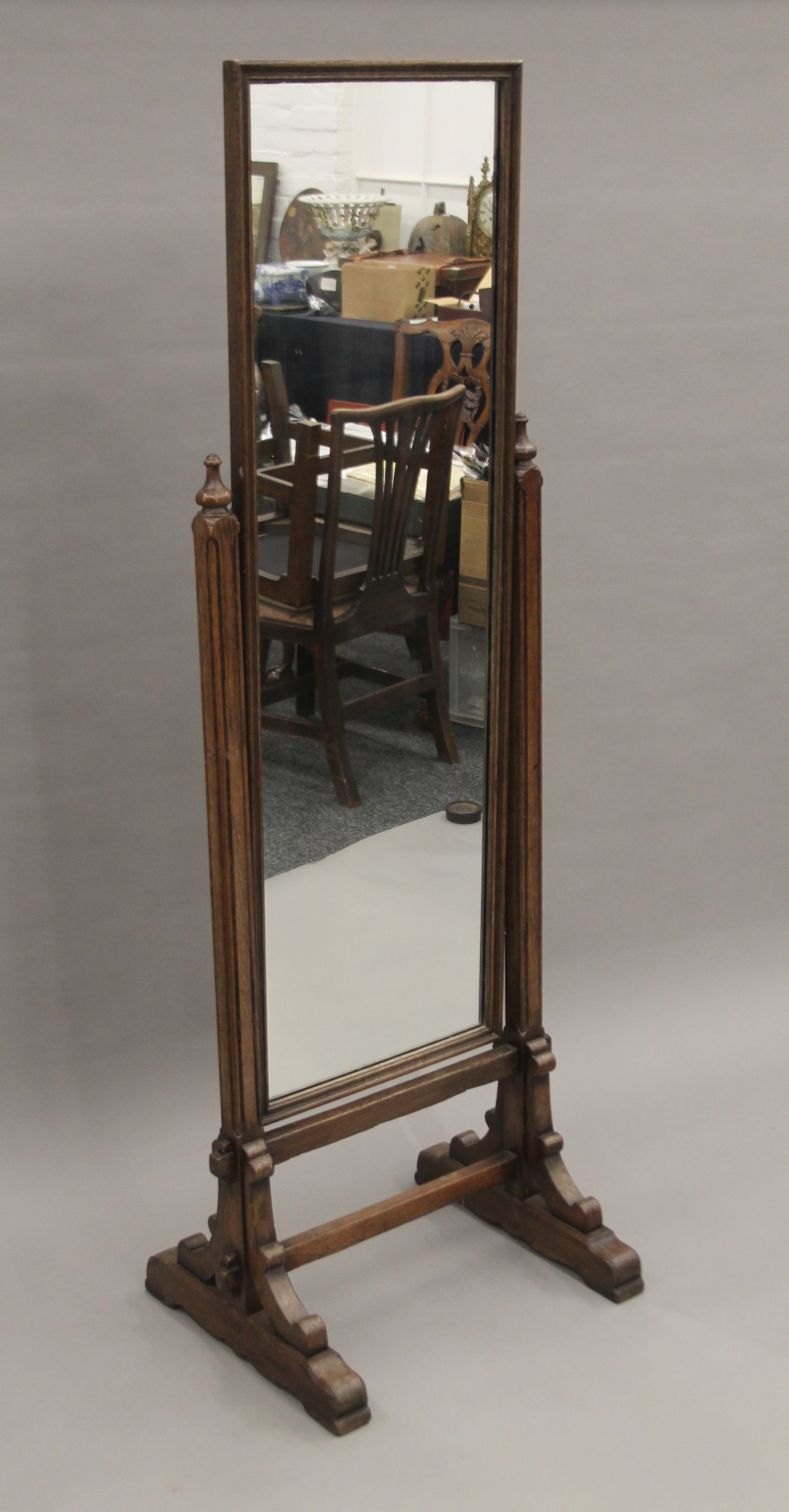 An early 20th century carved oak cheval mirror. 168.5 cm high. - Image 2 of 4