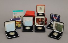 A quantity of various silver proof coins.