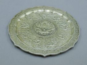 A Chinese white metal dish. 11.5 cm diameter.