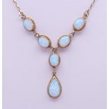 A 9 ct gold opal pendant necklace. 39 cm long. 7.2 grammes total weight.