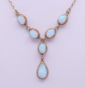 A 9 ct gold opal pendant necklace. 39 cm long. 7.2 grammes total weight.