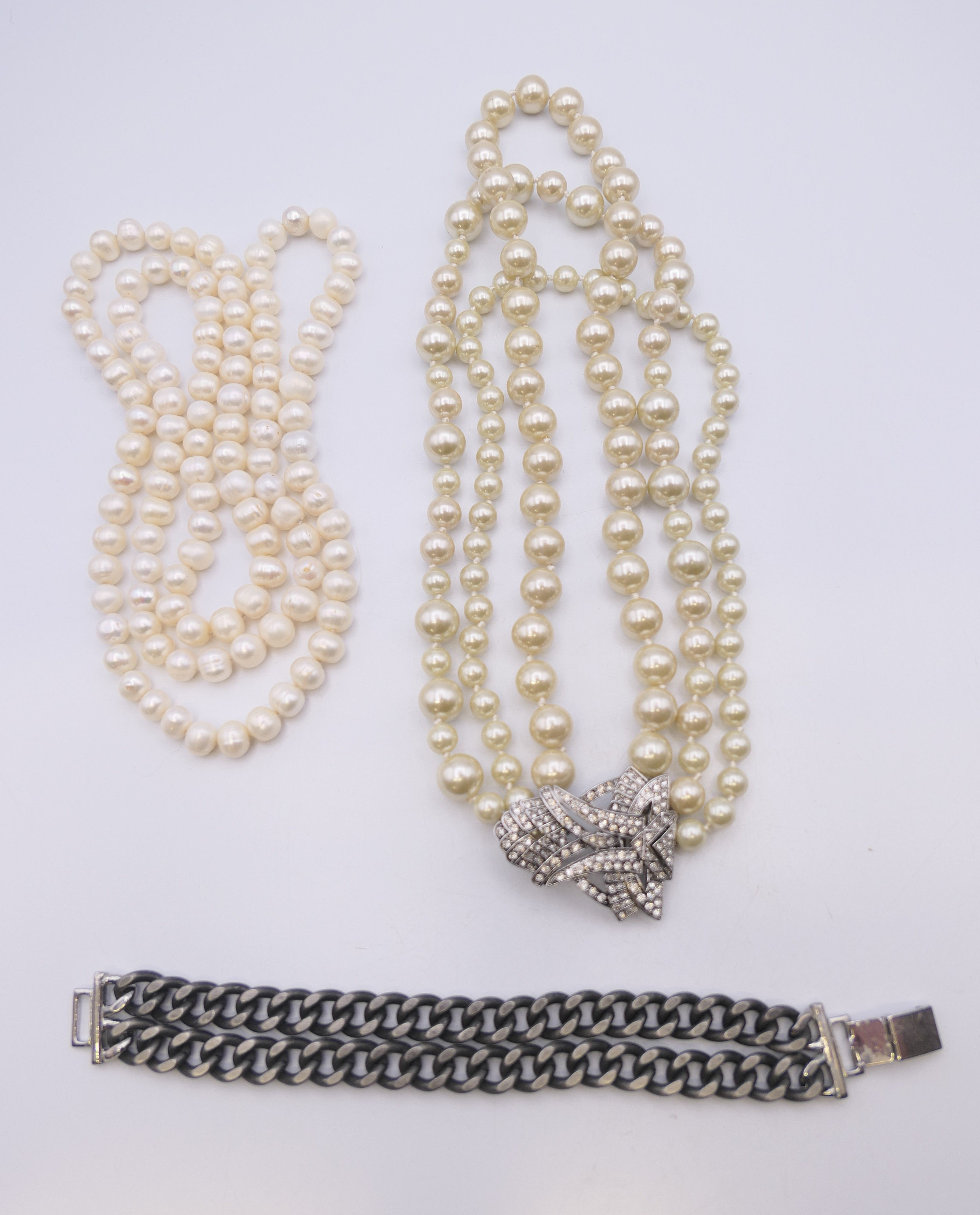 A Stellar & Dot designer pearl necklace, another pearl necklace and a bracelet.