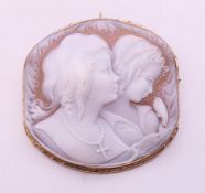 A large 9 ct gold mounted double cameo signed Sonintino. 5.5 cm wide.