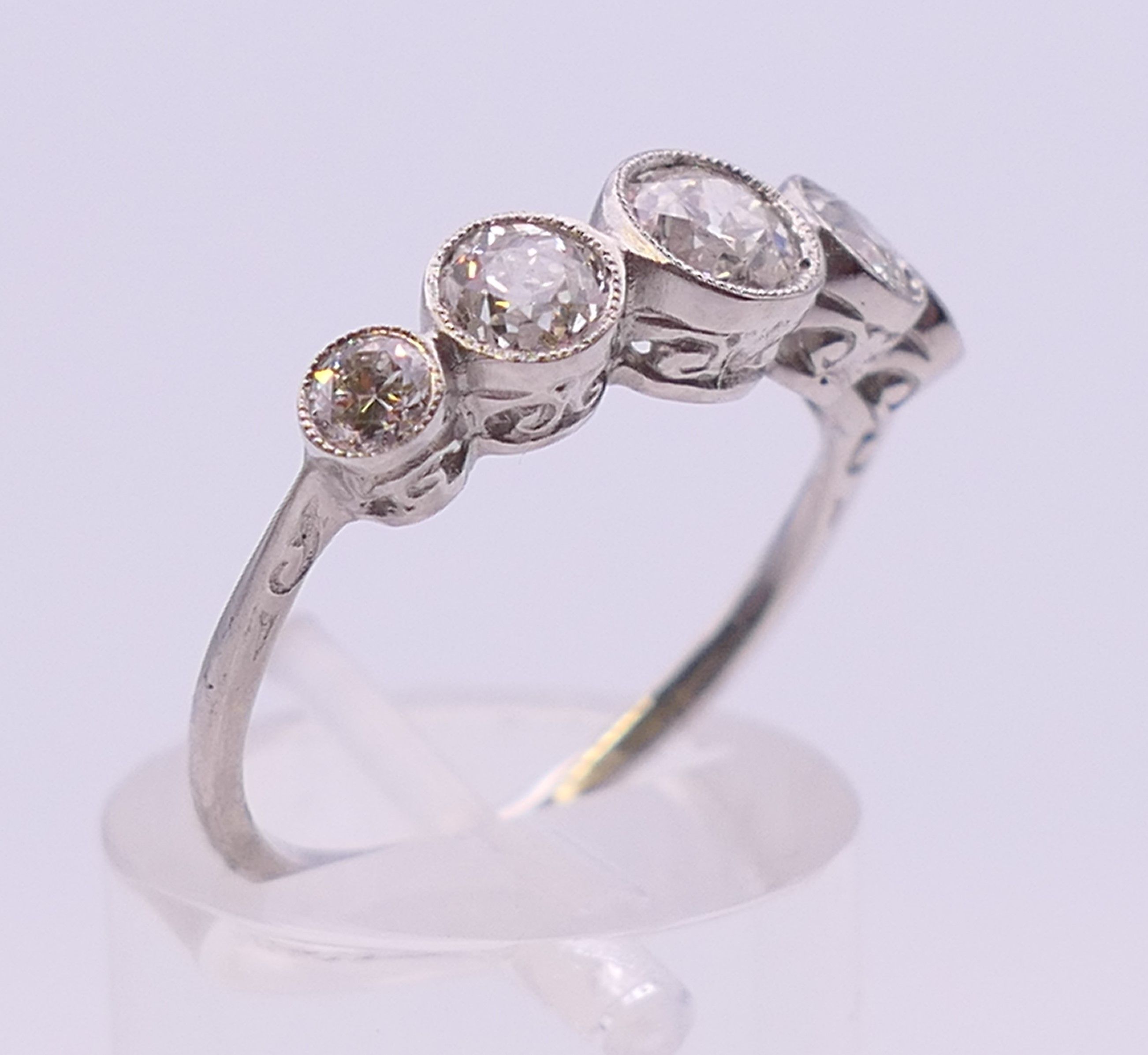 A platinum five stone diamond ring. Ring size N/O. - Image 3 of 6