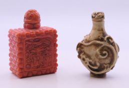 Two Chinese snuff bottles. The largest 7 cm high.