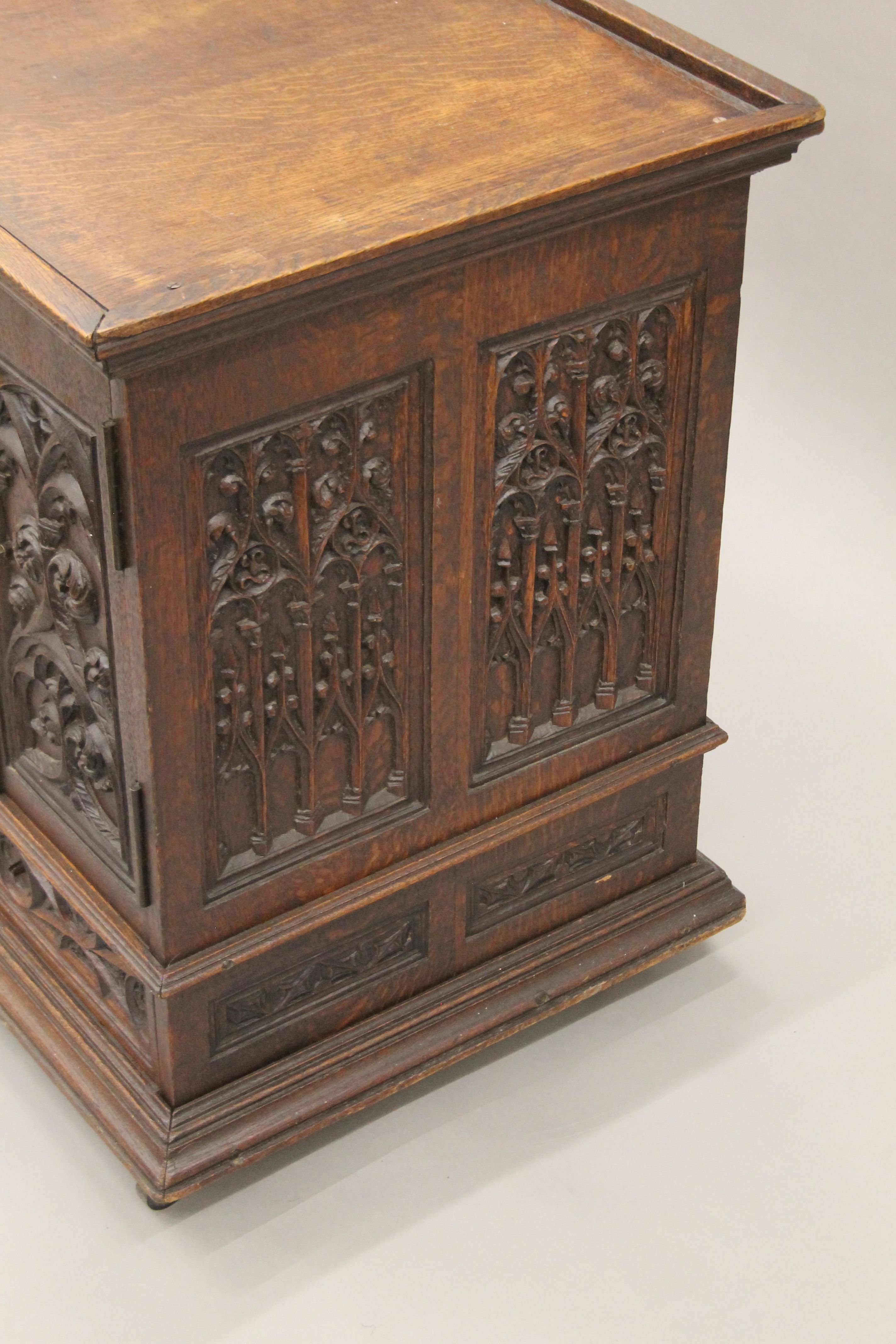 A small Victorian carved oak Gothic Revival cabinet with base drawer. 51.5 cm square. - Image 6 of 7