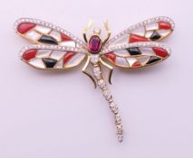An 18 ct gold diamond, coral and mother-of-pearl dragonfly form brooch. 5 cm long, 7 cm wide. 21.
