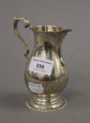 A silver jug. 12.5 cm high. 220.8 grammes.