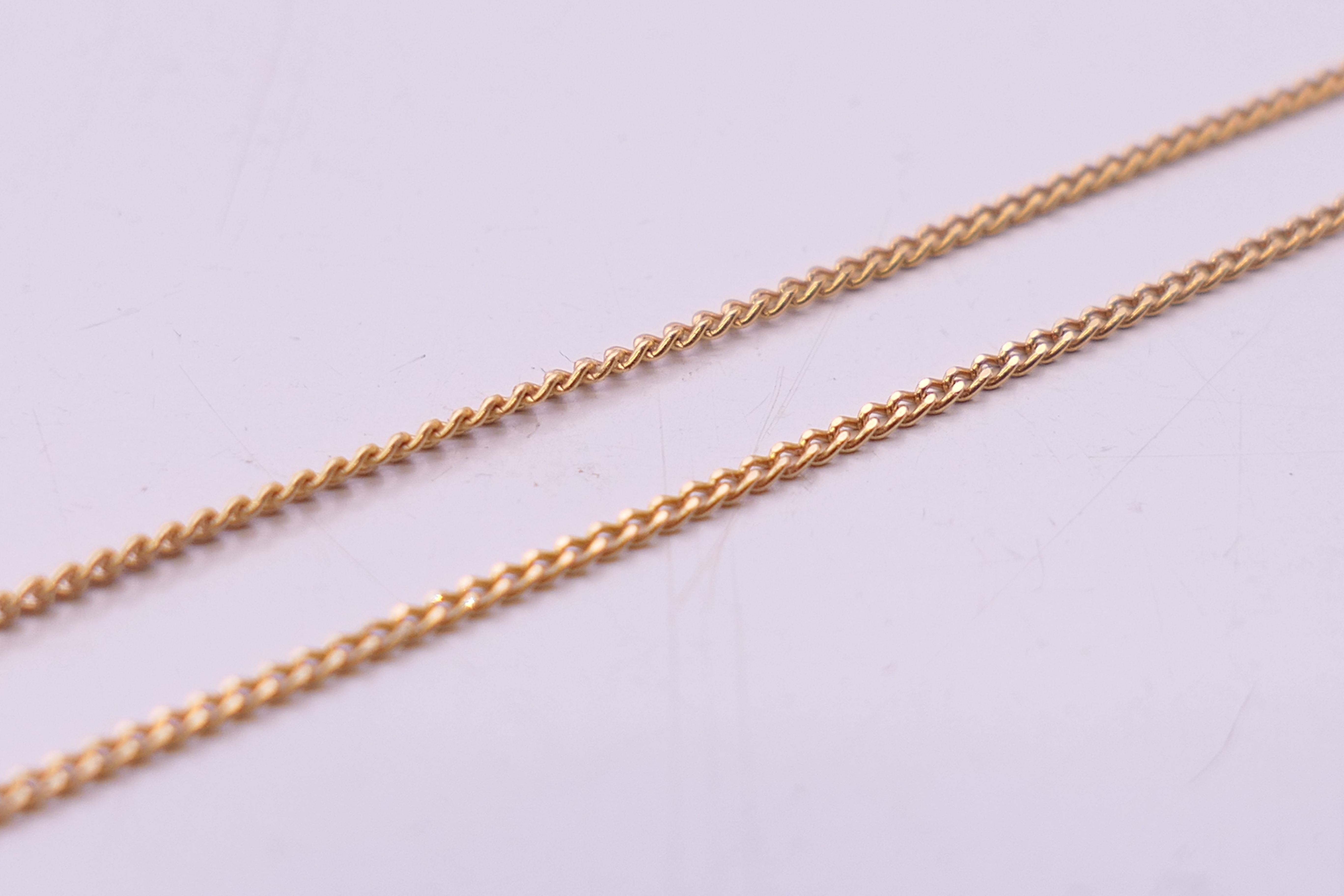 A 9 ct gold diamond set T-bar on a 9 ct gold chain. Bar 2.5 cm long, chain 41 cm long. 3. - Image 5 of 6
