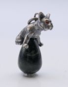 A pendant surmounted with a silver French bulldog, bearing Russian marks. 2.75 cm high.