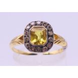 An 18 ct gold citrine and diamond ring. Ring size P.