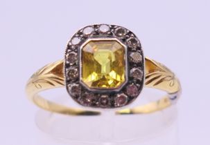 An 18 ct gold citrine and diamond ring. Ring size P.