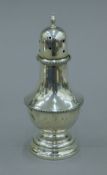 A silver sugar caster. 17.5 cm high. 200.5 grammes loaded.