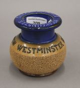 A Royal Doulton match striker vesta advertising Westminster Beers. 8.5 cm high.