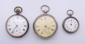 Three pocket watches. The largest 5 cm diameter.