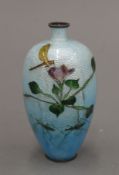 A late 19th/early 20th century Japanese cloisonne vase decorated with insects amongst foliage,
