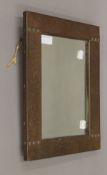 An Arts and Crafts beaten copper mirror. 28 x 38 cm.