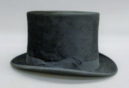 A vintage Jones & Dunn top hat.