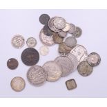 A quantity of various coins. The largest 3.5 cm diameter.