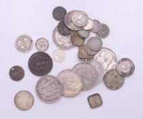 A quantity of various coins. The largest 3.5 cm diameter.