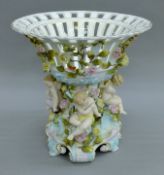 A 19th century Continental figural porcelain tazza. 30 cm high.