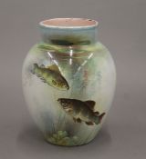A 19th century vase decorated with fish. 13.5 cm high.