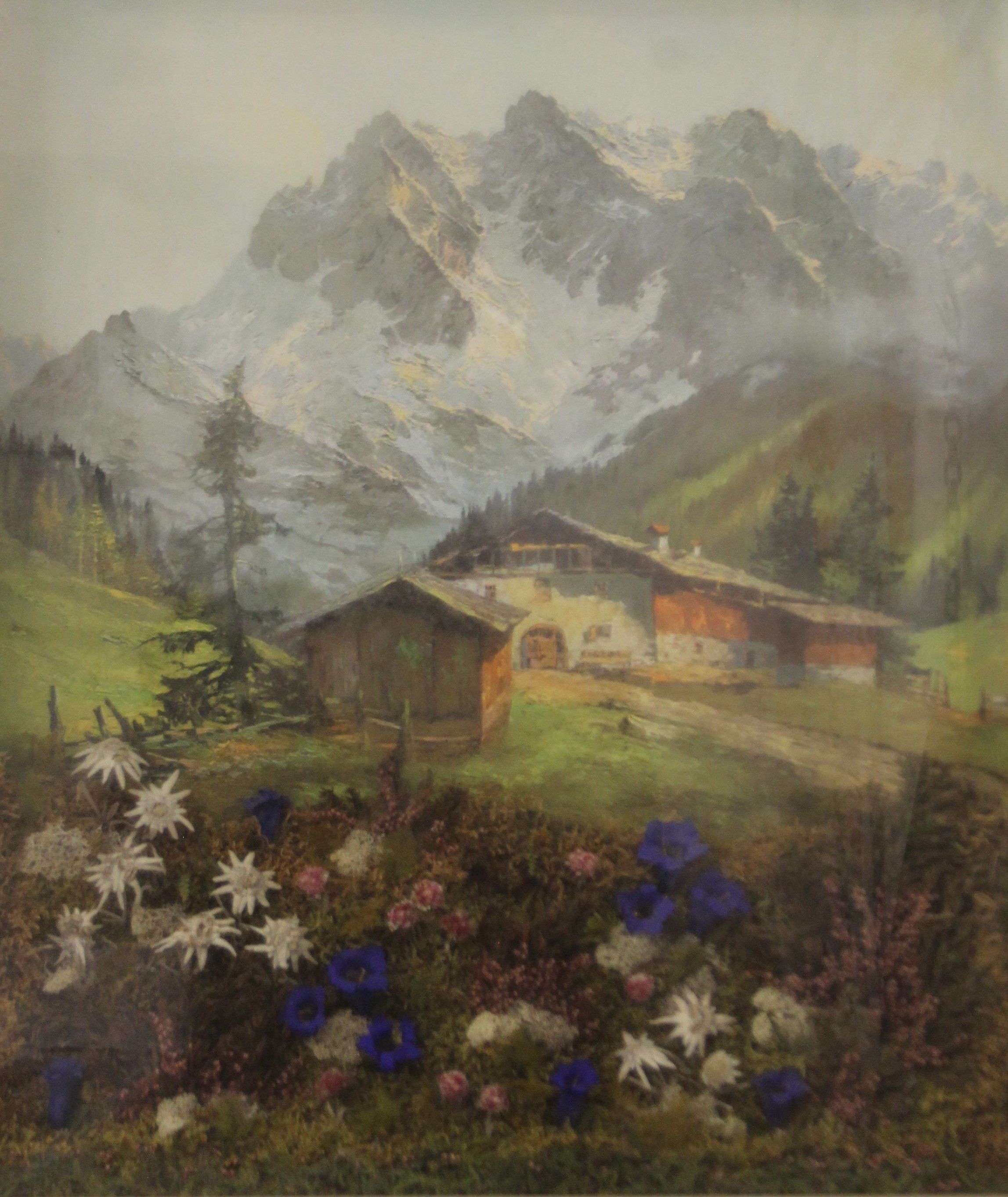 A kitsch print and collage of an Alpine scene, framed and glazed. 61.5 x 73.5 cm.