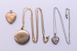 Three lockets - two on chains. The largest 2.75 cm diameter.