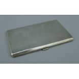 A silver cigarette case. 14 cm high. 214.1 grammes.