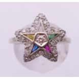 A 10 ct gold diamond multi-gem star ring. Ring size P.