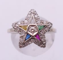 A 10 ct gold diamond multi-gem star ring. Ring size P.