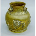 An 18th century Chinese gilt bronze repousse Qilin and Peach vase,