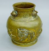 An 18th century Chinese gilt bronze repousse Qilin and Peach vase,