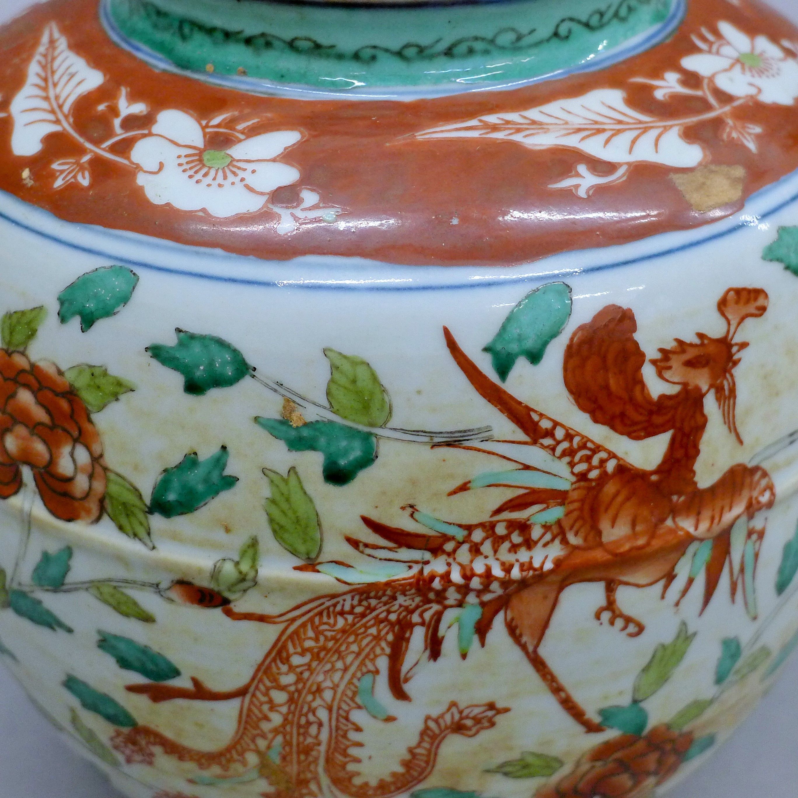 A 20th century Chinese Wucai enamelled ginger jar depicting a pair of phoenixes amongst a floral - Image 5 of 7