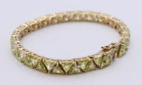A silver gilt triangular set bracelet. 18.5 cm long.